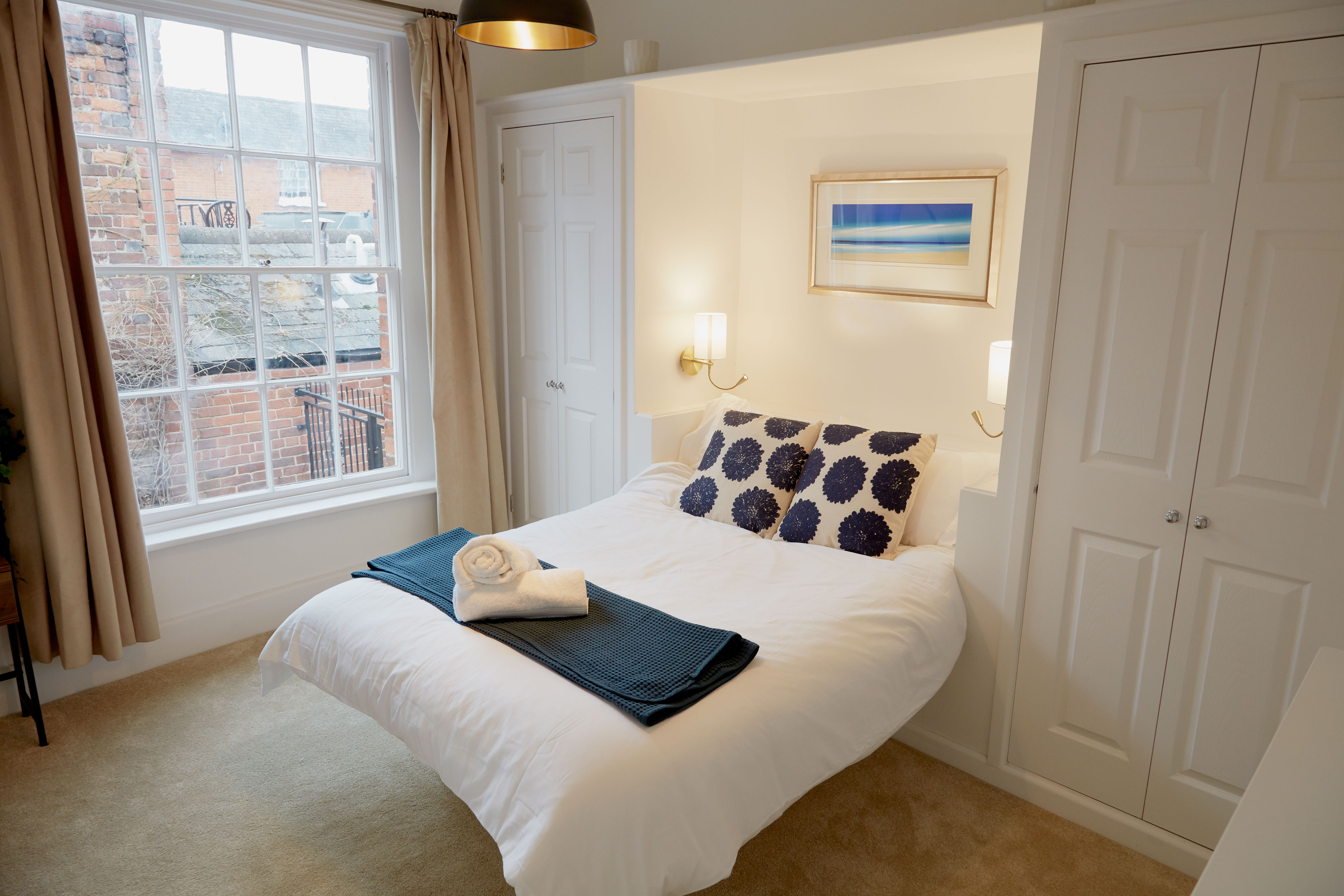 Upstairs double bedroom with sash window onto the alleyway